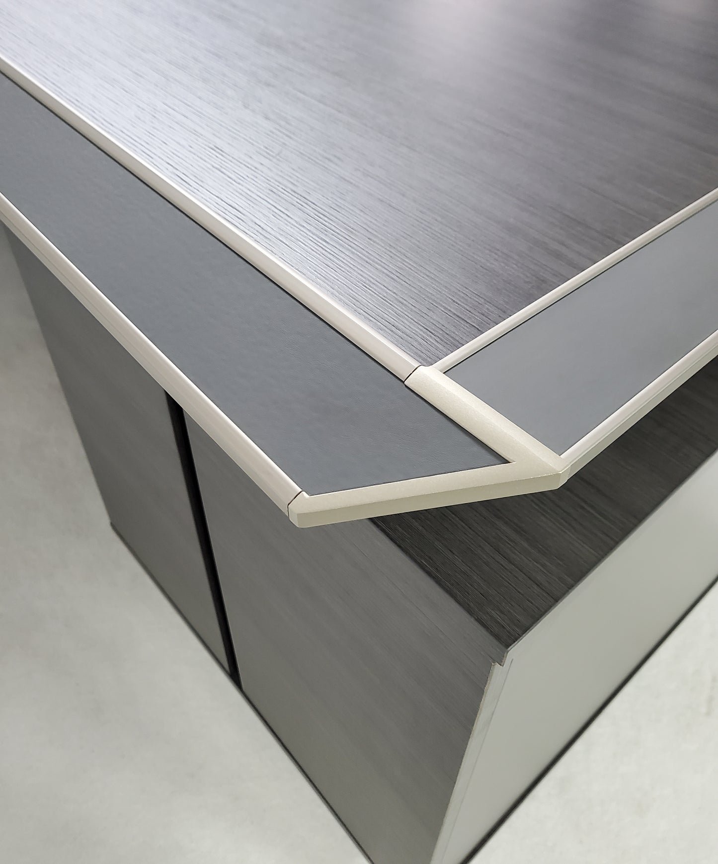 corner of grey office desk