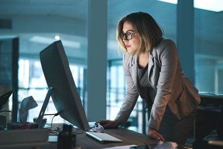 Woman working at a standing desk 